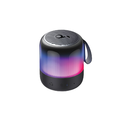 A portable cylindrical Bluetooth speaker with a black textured top and base, featuring a translucent body that glows with blue, purple, and pink LED light, and includes a black carrying strap on a white background.